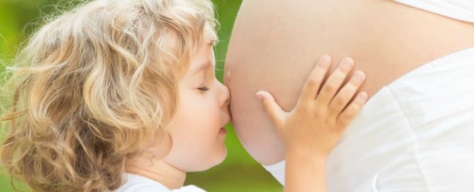 Boy Cuddles Mother without breast cancer