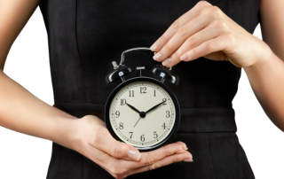 female holding the biological clock