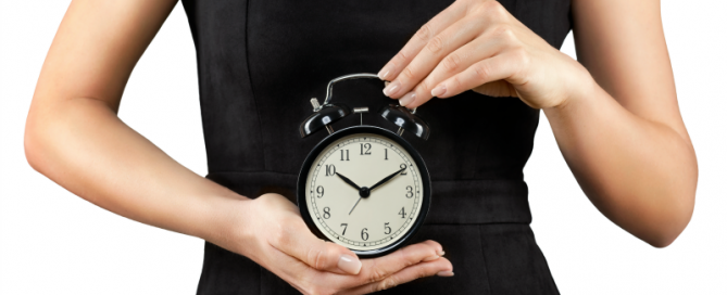 female holding the biological clock