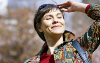 Happy Woman Taking Vitamin D for her Fertility